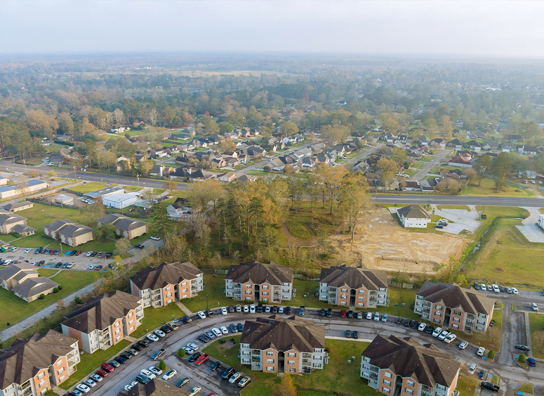 Contact - Aerial View of a Small Suburb Town in Louisiana
